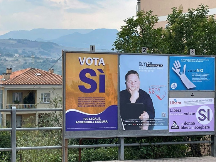 A billboard showing both both pro- and anti-abortion posters in San Marino ahead of the abortion referendum