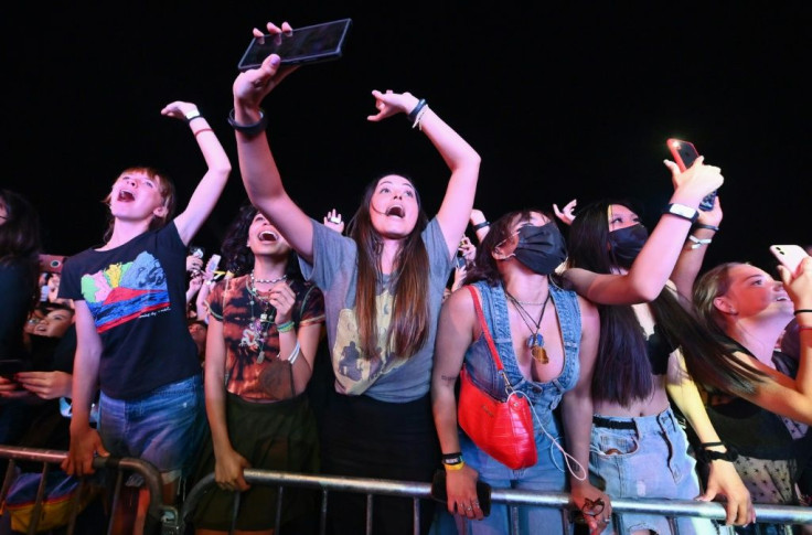 People cheer as Coldplay perform during the 2021 Global Citizen Live festival at the Great Lawn, Central Park on September 25, 2021 in New York City