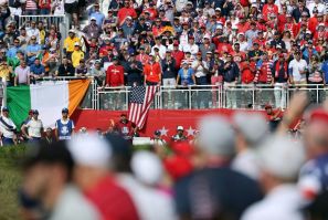 American Xander Schauffele tees off in his singles match against Europe's Rory McIlroy on the final day of the 43rd Ryder Cup