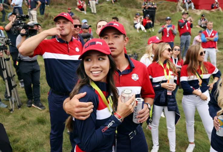 American Collin Morikawa and girlfriend Katherine Zhu along with Bryso DeChambeau and other US teammates celebrate their win over Europe at the 43rd Ryder Cup