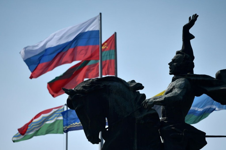 Flags of Russia and Transnistria -- which professes allegiance to Moscow -- flutter by a monument to 18th century Russian military commander Alexander Suvorovin in Tiraspol