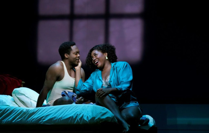 Actors Angel Blue (R) and Will Liverman perform a scene during a rehearsal for Terence Blanchard's "Fire Shut Up in My Bones," the first opera staged by a Black composer at the Metropolitan Opera