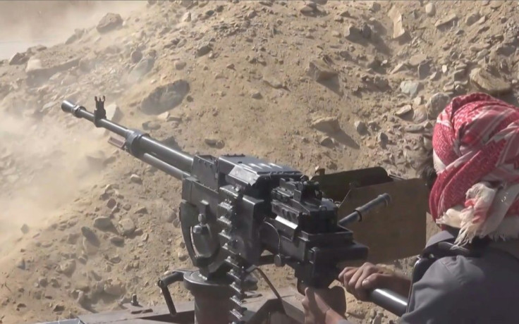 A grab from an AFPTV video shows a Yemeni pro-government fighter firing at positions of the Iran-backed Huthi rebels as they inch closer to the loyalists' last northern bastion, the strategic city of Marib, on September 27