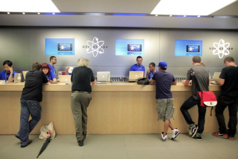 People are served at the Genius Bar at the Apple Store 5th Avenue in New York