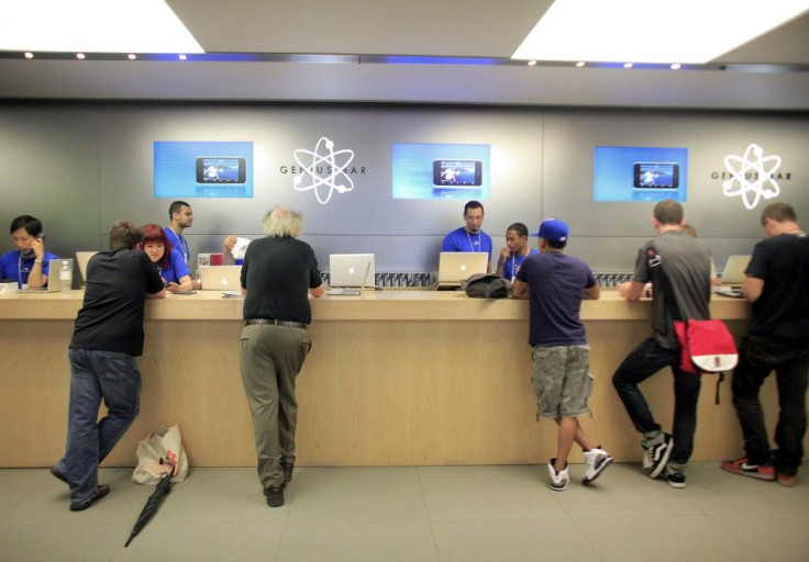 People are served at the Genius Bar at the Apple Store 5th Avenue in New York
