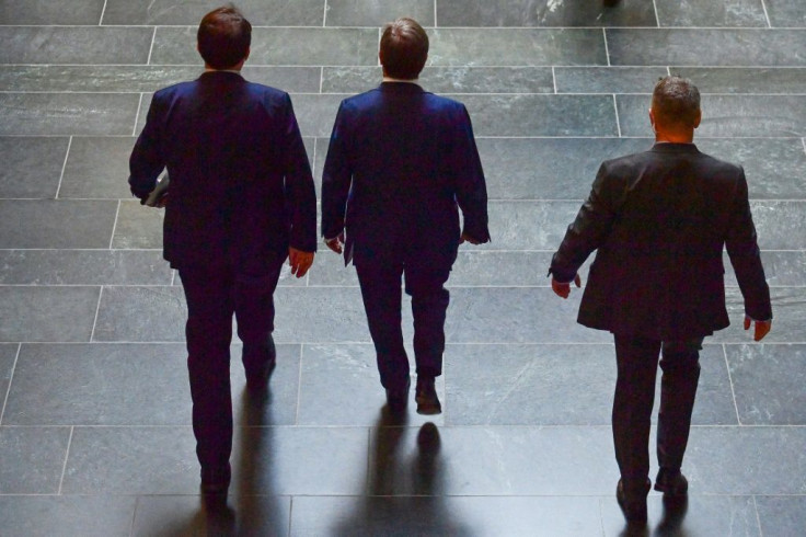 Candidate for Chancellor Armin Laschet (C) leaves the the Bundestag after his CDU-CSU conservative alliance brought home its worst election result in post-war Germany