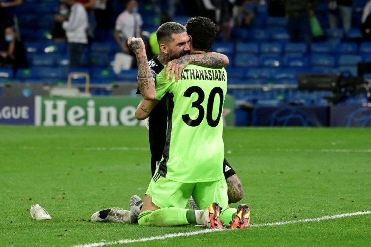 Sheriff's Dimitrios Kolovos and goalkeeper Giorgos Athanasiadis celebrate after beating Real Madrid in the Champions League on Tuesday.