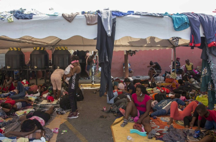 Haitian migrants rest outside a shelter in Monterrey in northern Mexico