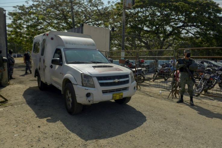 An ambulance exits the prison in Guayaquil, Ecuador, on September 29, 2021 following a bloody clash at the facility