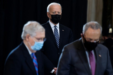 President Joe Biden's domestic agenda depends on the outcome of a battle between Democratic Senate Majority Leader Chuck Schumer (right) right, and his Republican counterpart Mitch McConnell over government spending and debt