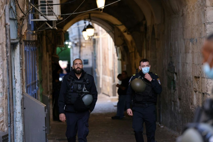 Israeli police stand guard outside Jerusalem's Al-Aqsa mosque compound after a woman, who tried to stab officers, was shot dead