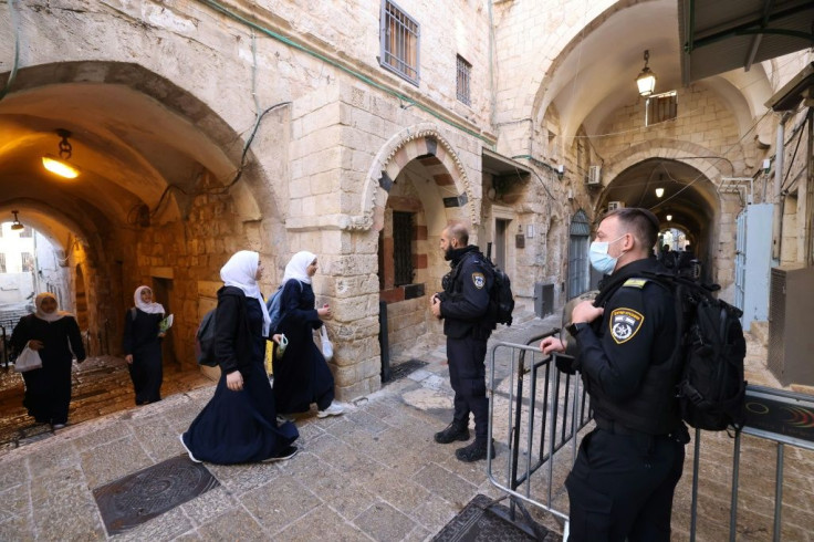 Israeli security forces are stationed at each entrance to the Al-Aqsa mosque compound in the alleyways of Jerusalem's walled Old City