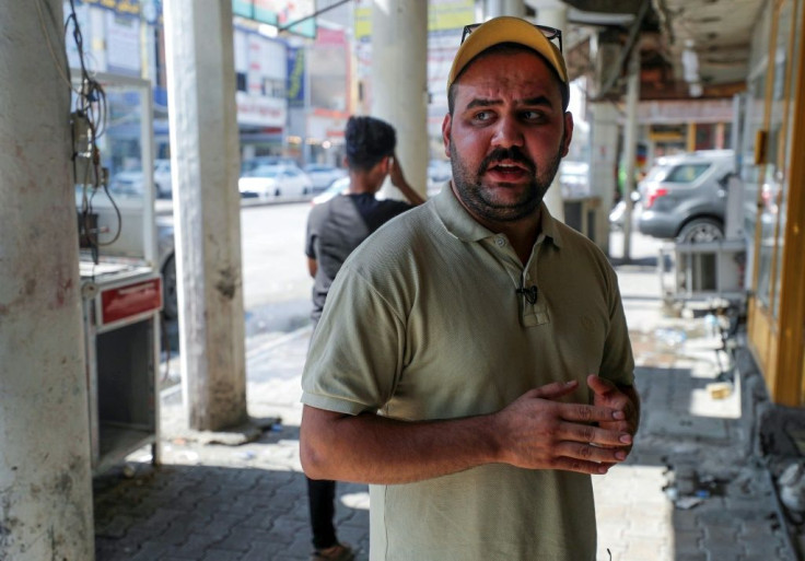Iraqi graduate Haider Jaafar, 23, speaks during an interview at Al-Haboubi Square in the southern city of Nasiriyah