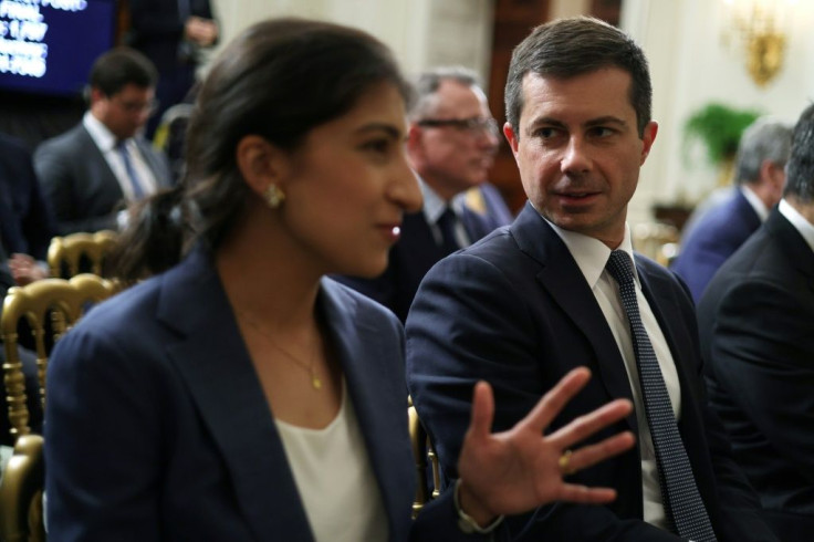 Chairperson of the Federal Trade Commission Lina Khan (L) with Transportation Secretary Pete Buttigieg as they at the White House July 9, 2021 in Washington, DC.