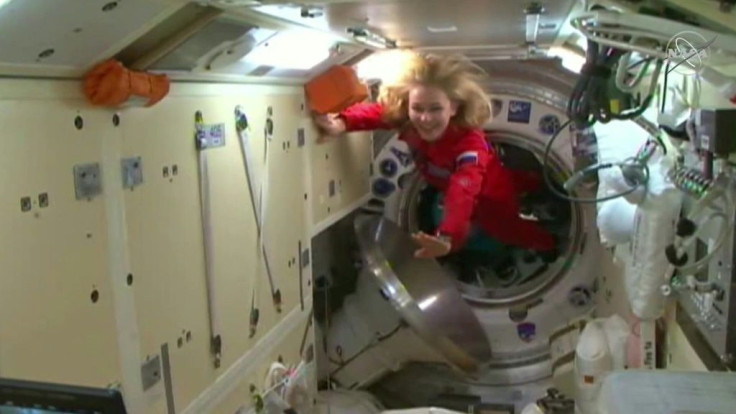 Russian actress Yulia Peresild and director Klim Shipenko arrive at the International Space Station