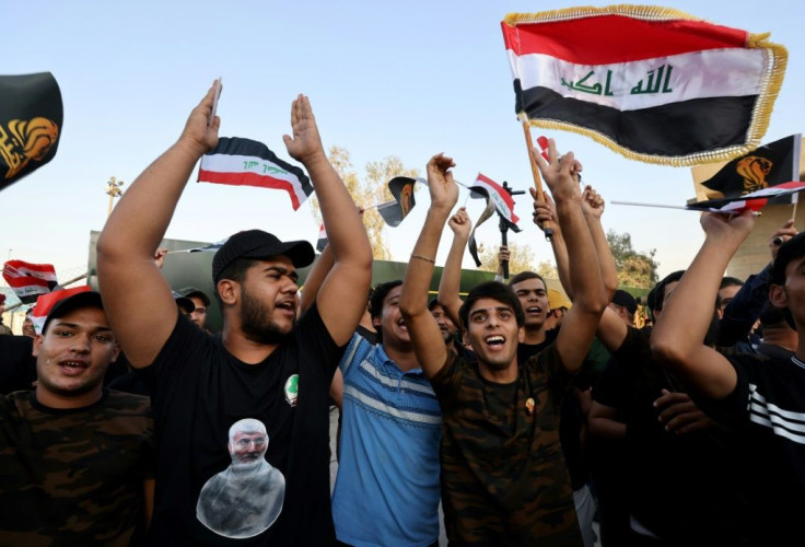 Supporters of Iraq's Fatah alliance -- which held the second-biggest bloc in parliament -- attend an election rally in Baghdad