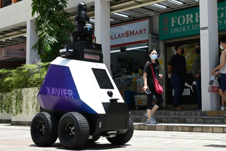 Armed with seven cameras, a Xavier robot in Singapore issues warnings to the public and detects 'undesirable social behaviour'