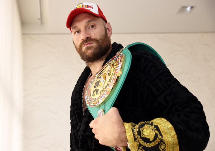 Tyson Fury poses with the WBC heavyweight championship