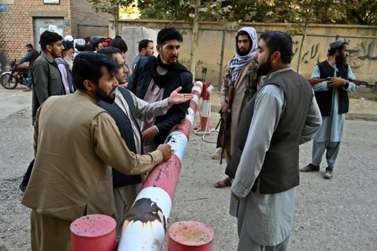 Hundreds of people flocked to the department to apply for travel documents in a test of the new Afghan government's commitment to allow eligible people to leave