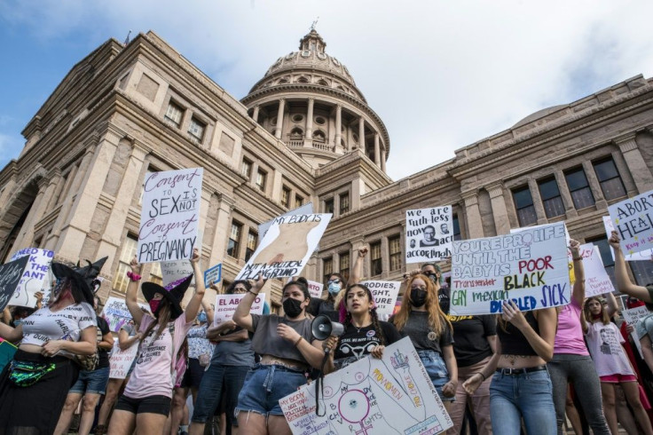 Protesters take part in the Women's March and Rally for Abortion Justice at the State Capitol in Austin, Texas on October 2, 2021