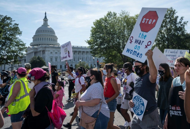 Protesters march past the US Capitol as they take part in the Women's March and Rally for Abortion Justice in Washington, DC, on October 2, 2021