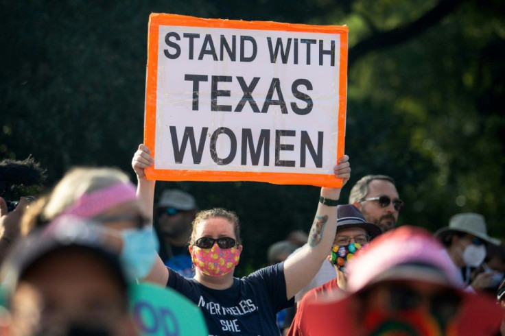 Demonstrators rally against anti-abortion and voter suppression laws at the Texas state capitol in Austin, on October 2, 2021