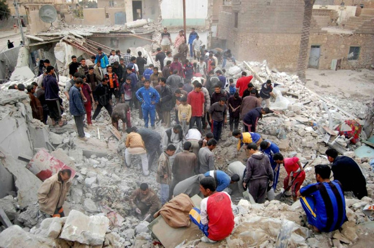 Iraqis search for survivors in the rubble of a bombed house in Ramadi on February 22, 2007 after an airstrike and battle between US Marines and insurgents