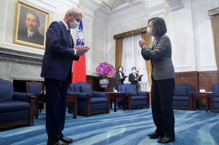 Taiwan President Tsai Ing-wen (R) greets French senator Alain Richard at the Presidential Office in Taipei