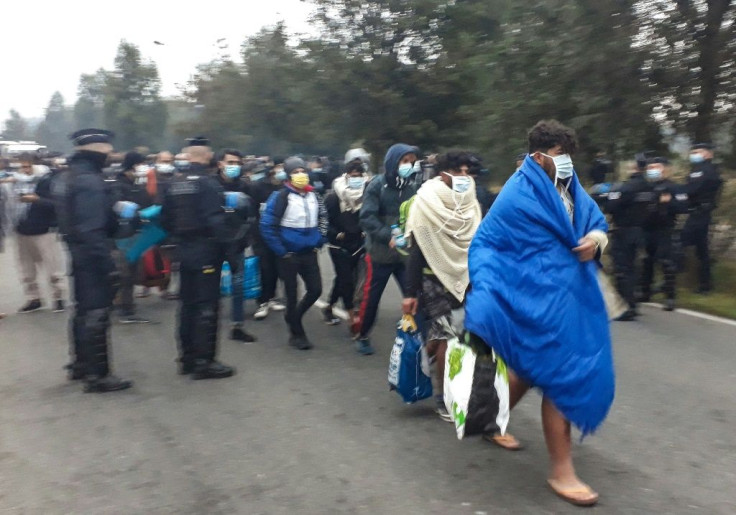 French police evacuating hundreds of migrants last week after dismantling their camp near a hospital in Calais