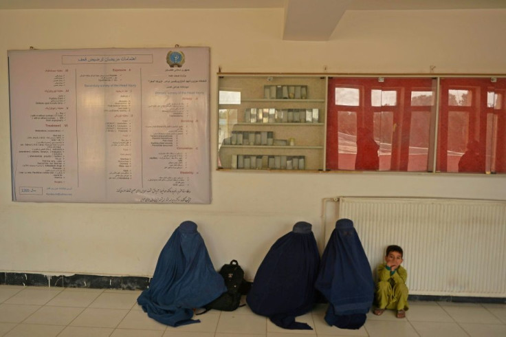 Families wait at the regional hospital in Kunduz where victims of the suicide bombing at the Gozar-e-Sayed mosque are being treated