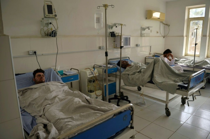 Victims who were injured in October 8 suicide bombing at the Gozar-e-Sayed mosque, rest inside a regional hospital in Kunduz