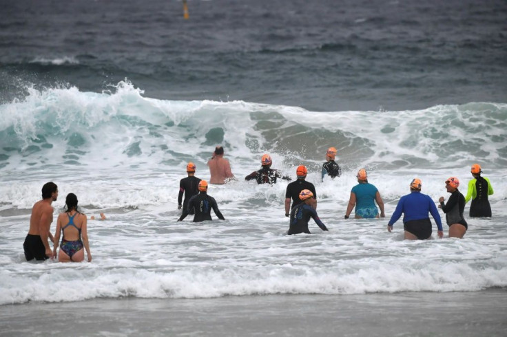 Sydney residents enjoy the waves at Bondi beach at the end of a 106-day lockdown