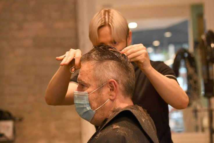 Many queued up at hair salons and barbers to get their first haircuts in months