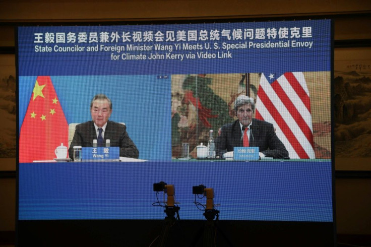 US climate envoy John Kerry meets with China's Foreign Minister Wang Yi via a video link during Kerry's visit in Tianjin in September 2021