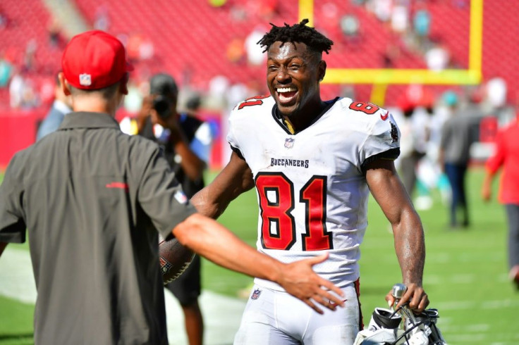 Tampa Bay's Antonio Brown celebrates after his record-setting day helped the Bucs to a 45-17 NFL victory over the Miami Dolphins