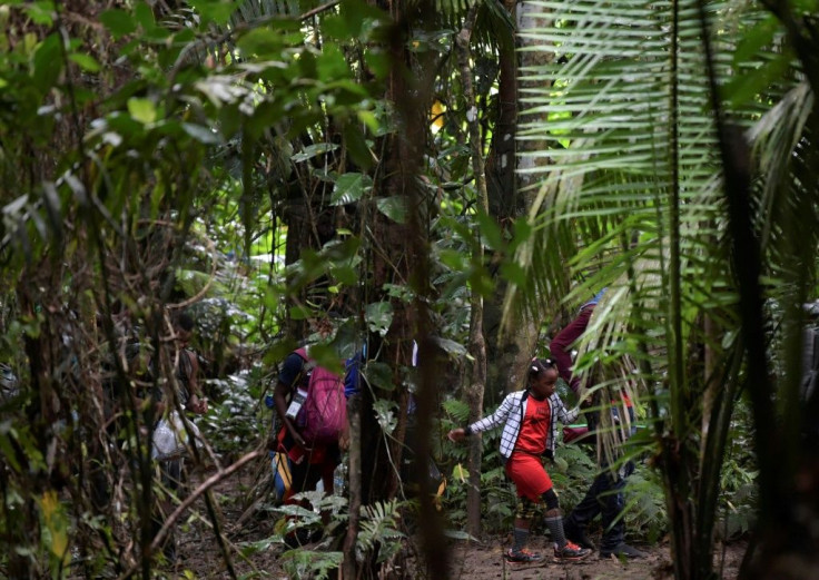 A Haitian migrant girl is seen crossing the Darien Gap jungle between Colombia and Panama in September 2021 -- a record number of children have made the trek in 2021, UNICEF says