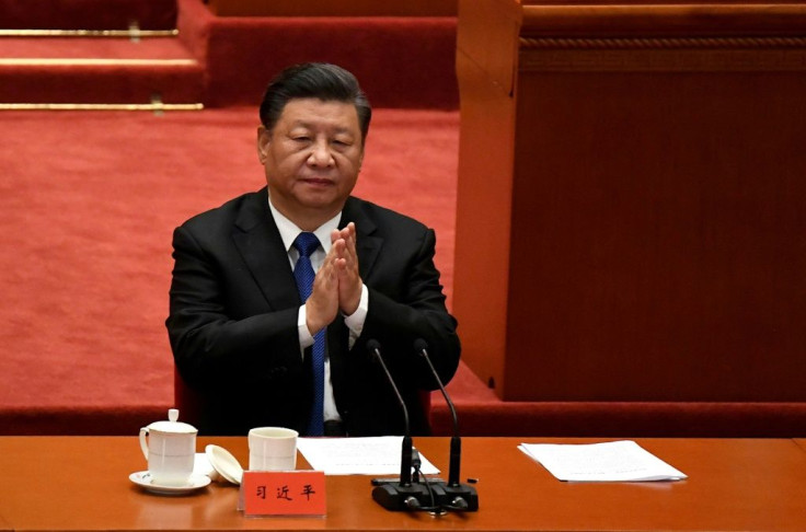 Chinese President Xi Jinping marks the 110th anniversary of the overthrow of the Qing Dynasty, which prompted the founding of the Republic of China, at the Great Hall of the People in Beijing on October 9, 2021