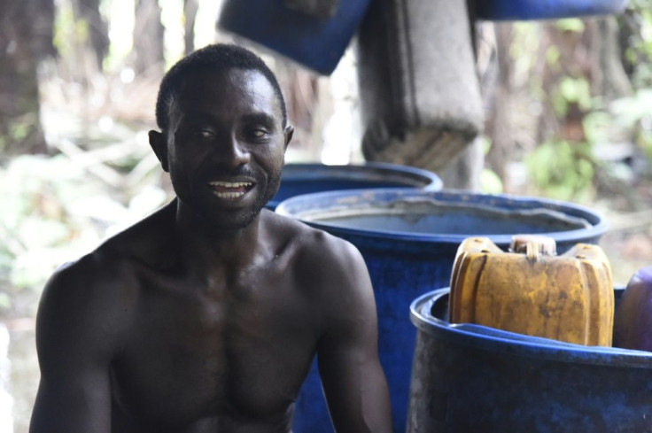 Wilson Ovwiroro taps raffia trees for their sap -- the source of a gin-like drink he makes called ogogoro