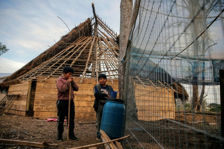 In the Mapuche Fermin Manquilef village in Araucania, indigenous people live in traditional wood and straw homes