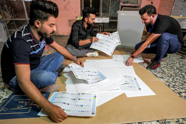 Iraqi election officials on Sunday conducted a manual count of votes as part of the verification process for the electronic count, at a polling station in Baghdad