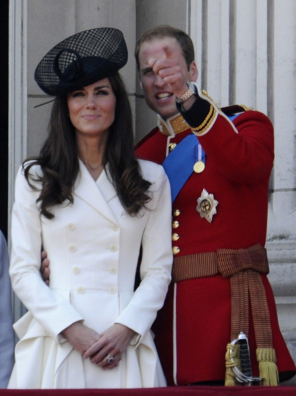 Britains Prince William holds his wife Catherine, Duchess of Cambridge