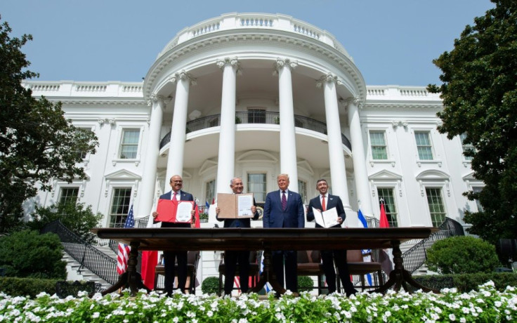 Bahrain Foreign Minister Abdullatif al-Zayani, Israeli Prime Minister Benjamin Netanyahu, US President Donald Trump and UAE Foreign Minister Abdullah bin Zayed Al-Nahyan sign the Abraham Accords on September 15, 2020