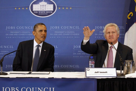 U.S. President Barack Obama sits next to Chairman of the council and CEO of General Electric Jeffrey Immelt