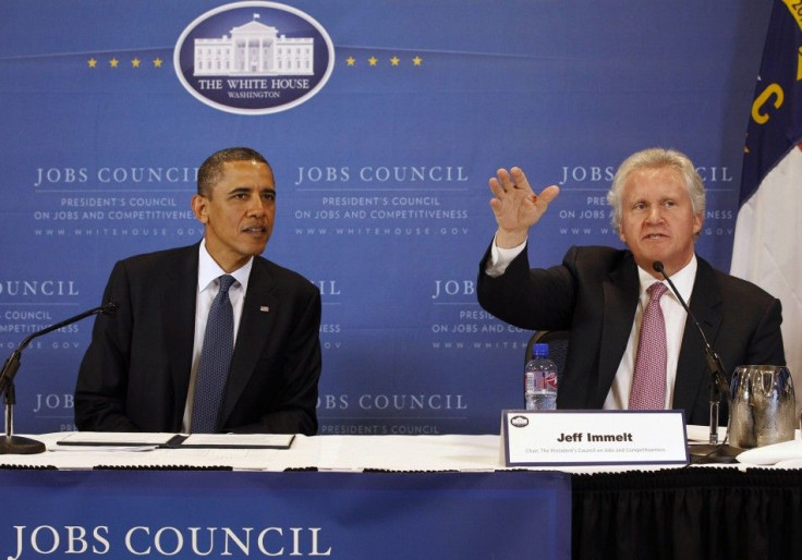 U.S. President Barack Obama sits next to Chairman of the council and CEO of General Electric Jeffrey Immelt