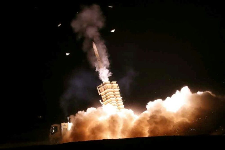 A photo from the Iranian Army office shows an anti-aircraft missile launcher firing a salvo during a joint military exercise between the army and the Islamic Revolutionary Guard Corps