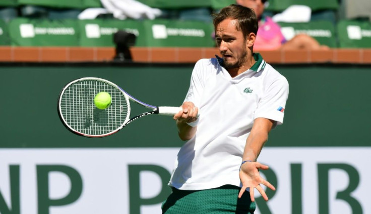 US Open champ Daniil Medvedev of Russia hits a forehand return to Grigor Dimitrov of Bulgaria in their fourth round match at the Indian Wells tennis tournament in southern California