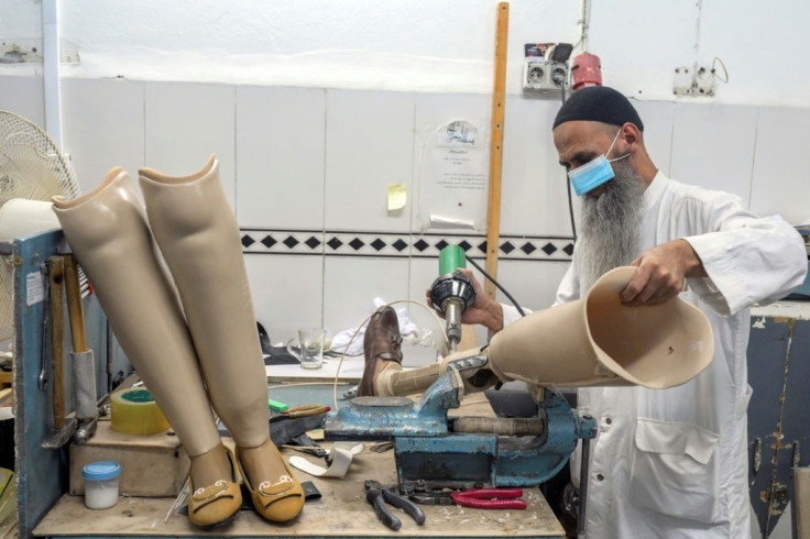 A technician works on prosthetic leg at the International Committee of Red Cross Rehabilitation Centre in Kabul