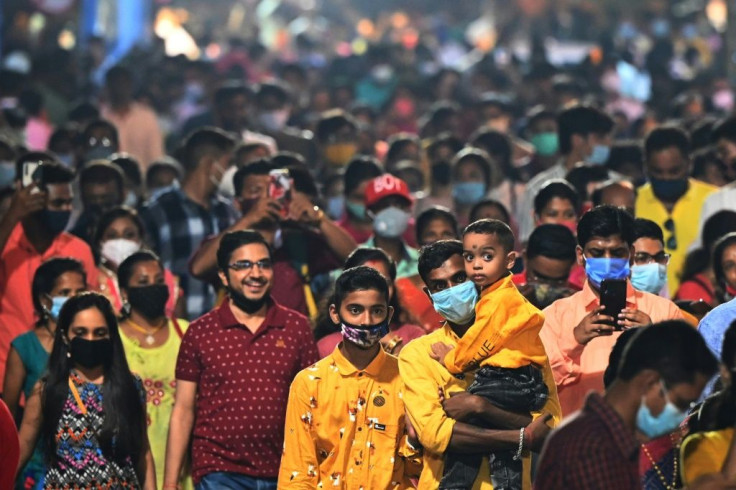 India's main religious festival season is back in full swing with huge noisy crowds thronging markets and fairs for the first time in two years