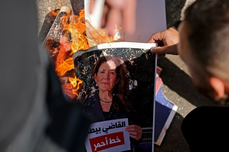 A Shiite protester burns a portrait of US ambassador Dorothy Shea at a rally near the Palace of Justice in the Lebanese capital