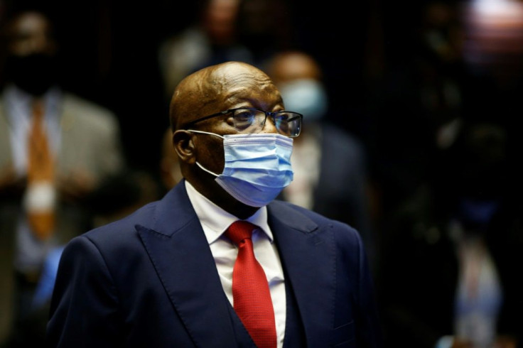 Zuma, pictured in May at his corruption trial in Pietermaritzburg. He faces 16 charges relating to the 1999 purchase of fighter jets, patrol boats and military gear